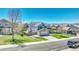 Aerial view of a lovely home with a well-manicured lawn, charming exterior, and a two-car garage at 5912 Randolph Ave, Castle Rock, CO 80104