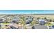 Wide aerial view of a suburban neighborhood with well-maintained homes and picturesque mountain views in the distance at 5912 Randolph Ave, Castle Rock, CO 80104