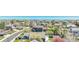 Wide aerial view of a suburban neighborhood with tree-lined streets and well-maintained homes and lawns at 5912 Randolph Ave, Castle Rock, CO 80104