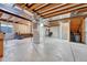 Unfinished basement featuring concrete floor, exposed ceiling, and ample space for customization and storage at 5912 Randolph Ave, Castle Rock, CO 80104