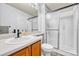 Bathroom featuring a glass enclosed shower, vanity and toilet at 5912 Randolph Ave, Castle Rock, CO 80104