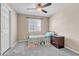 Neutral bedroom with natural light, carpet, and ceiling fan at 5912 Randolph Ave, Castle Rock, CO 80104