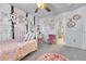 This charming bedroom features a fun decor, ceiling fan, neutral carpet, and a window at 5912 Randolph Ave, Castle Rock, CO 80104