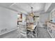 Elegant dining room with a wooden table, stylish chairs, and modern lighting fixture at 5912 Randolph Ave, Castle Rock, CO 80104