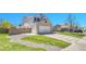 Charming home exterior featuring a two-car garage, manicured lawn, and thoughtful rock landscaping at 5912 Randolph Ave, Castle Rock, CO 80104