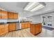 Spacious kitchen with wooden cabinets, stainless steel appliances, and a central island at 5912 Randolph Ave, Castle Rock, CO 80104