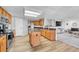 Open kitchen featuring an island, stainless steel appliances, and wood cabinets at 5912 Randolph Ave, Castle Rock, CO 80104