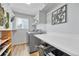 Laundry room with gray washer and dryer, counter, and shelving at 5912 Randolph Ave, Castle Rock, CO 80104