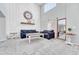 Beautiful living room with a high ceiling and large windows allowing ample natural light at 5912 Randolph Ave, Castle Rock, CO 80104