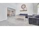Cozy living room featuring comfortable seating and an archway leading to the dining area at 5912 Randolph Ave, Castle Rock, CO 80104