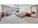Spacious main bedroom features a ceiling fan, neutral carpet, and sunny windows with window treatments at 5912 Randolph Ave, Castle Rock, CO 80104