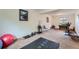 Basement transformed into a yoga studio, complete with workout equipment and natural light at 1062 Jasper St, Aurora, CO 80011