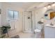 Bright bathroom with a glass-enclosed shower, tile floors, and modern fixtures at 1062 Jasper St, Aurora, CO 80011