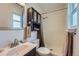 Bathroom with a shower, toilet, cabinet and sink and a window at 1062 Jasper St, Aurora, CO 80011
