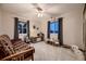 Spacious bedroom area features play area, large window and ceiling fan at 1062 Jasper St, Aurora, CO 80011