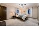 Cozy bedroom features soft lighting, a comfortable bed, and neutral tones, perfect for relaxing at 1062 Jasper St, Aurora, CO 80011