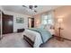 Comfortable bedroom featuring neutral walls, ample lighting, and soft textures, creating a cozy atmosphere at 1062 Jasper St, Aurora, CO 80011
