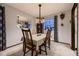 Inviting dining room with classic furniture, neutral decor, and natural light at 1062 Jasper St, Aurora, CO 80011