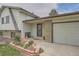 Charming single-Gathering home with a light exterior, front garden, and an attached garage at 1062 Jasper St, Aurora, CO 80011