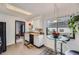 Bright kitchen with white cabinets, black appliances, butcher block counters, and a cozy breakfast nook by the window at 1062 Jasper St, Aurora, CO 80011