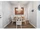 Charming dining area features a round table, elegant chandelier, and neutral color palette at 12570 Boggs St, Parker, CO 80134
