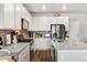 Well-equipped kitchen with stainless steel appliances, gray backsplash, and quartz countertops at 12570 Boggs St, Parker, CO 80134