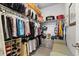 Well-organized walk-in closet with ample storage space and custom shelving units at 12570 Boggs St, Parker, CO 80134