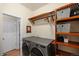 Laundry room with washer, dryer, and ample storage space at 1833 W 131St Dr, Westminster, CO 80234