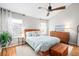 Main bedroom features a vaulted ceiling, wood furniture, and light-filled windows for a relaxing retreat at 230 W Jamison Cir # 31, Littleton, CO 80120