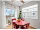 Dining room features a retro table set near sliding glass doors to deck with white window shades at 230 W Jamison Cir # 31, Littleton, CO 80120
