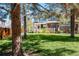 Street view of an attractive townhouse showcases landscaping, a covered porch, and neighborhood appeal at 230 W Jamison Cir # 31, Littleton, CO 80120