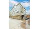 Exterior angle view of townhome featuring garage and upper level balcony at 230 W Jamison Cir # 31, Littleton, CO 80120