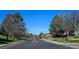 Neighborhood street view with landscaped sidewalks and mountain views at 230 W Jamison Cir # 31, Littleton, CO 80120