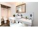 Modern bathroom with a vessel sink, and rustic wood accents at 6361 S Spotswood Cir, Littleton, CO 80120