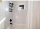 Bright bathroom with white subway tile in the shower/tub combo and sleek black fixtures at 6361 S Spotswood Cir, Littleton, CO 80120