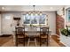 Dining room boasts a large window and a rustic-chic aesthetic at 6361 S Spotswood Cir, Littleton, CO 80120