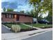 Charming home with a well-manicured lawn, brick facade, and inviting curb appeal at 6361 S Spotswood Cir, Littleton, CO 80120