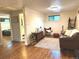 Cozy living room features wood floors, shiplap walls, and stylish decor, creating a warm and inviting space at 6361 S Spotswood Cir, Littleton, CO 80120
