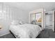 Bedroom featuring a closet with sliding mirror doors and neutral walls at 12592 E Bates Cir, Aurora, CO 80014