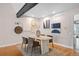 Cozy dining room with wood floors, sleek furniture and decor providing a great space for intimate gatherings at 12592 E Bates Cir, Aurora, CO 80014