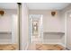 Neutral hallway featuring mirrored closet, tile floor, and shelf for decor at 12592 E Bates Cir, Aurora, CO 80014