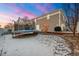 View of the backyard featuring a trampoline, deck, and exterior of the house at 5562 Gibraltar St, Denver, CO 80249