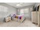 Cozy bedroom featuring a bed, dresser, and neutral-toned walls for a relaxing atmosphere at 5562 Gibraltar St, Denver, CO 80249