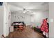 Charming bonus room featuring hardwood floors and a ceiling fan for added comfort at 5562 Gibraltar St, Denver, CO 80249