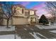 Charming two-story home featuring a stone facade and attached two-car garage at 5562 Gibraltar St, Denver, CO 80249