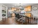 Kitchen with wooden cabinets, stainless steel appliances, and adjacent dining area at 5562 Gibraltar St, Denver, CO 80249