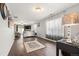 Spacious living room with hardwood floors, large windows, and neutral paint at 5562 Gibraltar St, Denver, CO 80249
