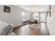 Bright living room with hardwood floors, a large window and neutral paint at 5562 Gibraltar St, Denver, CO 80249