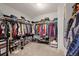 Large walk-in closet providing ample storage with shelving and hanging rods at 5562 Gibraltar St, Denver, CO 80249