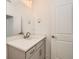 Contemporary bathroom featuring gray vanity with white countertop, brushed nickel fixtures, and large mirror at 305 Welded Tuff Trl, Castle Rock, CO 80104